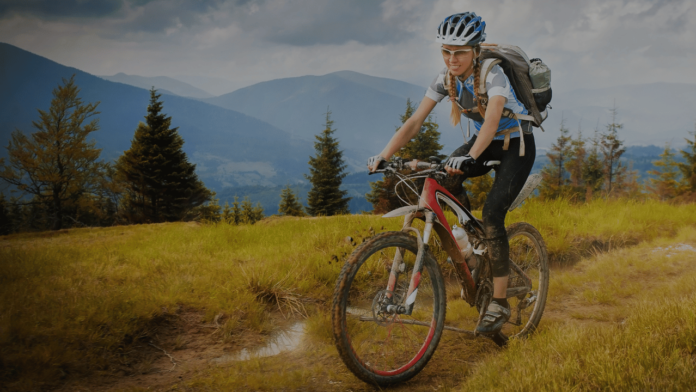 woman mountain biking in the high alpine