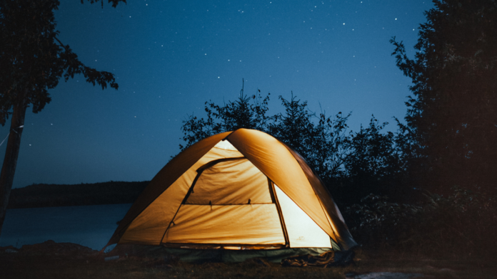 glowing tent under stars, women's camping gear